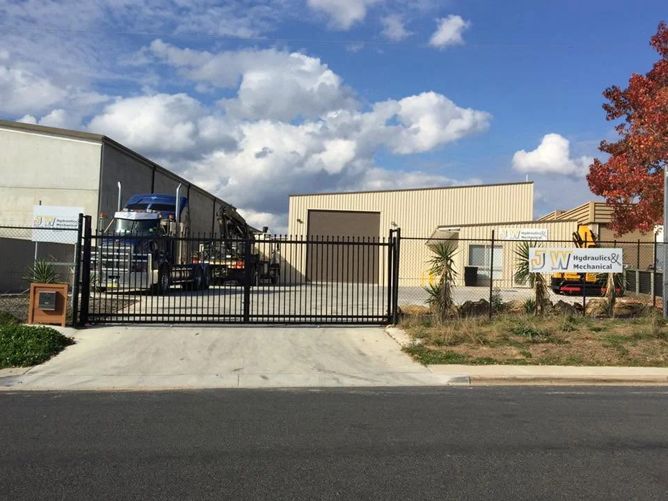 JW Hydraulics & Mechanical workshop frontage and gate at 76 High Street, Queanbeyan East