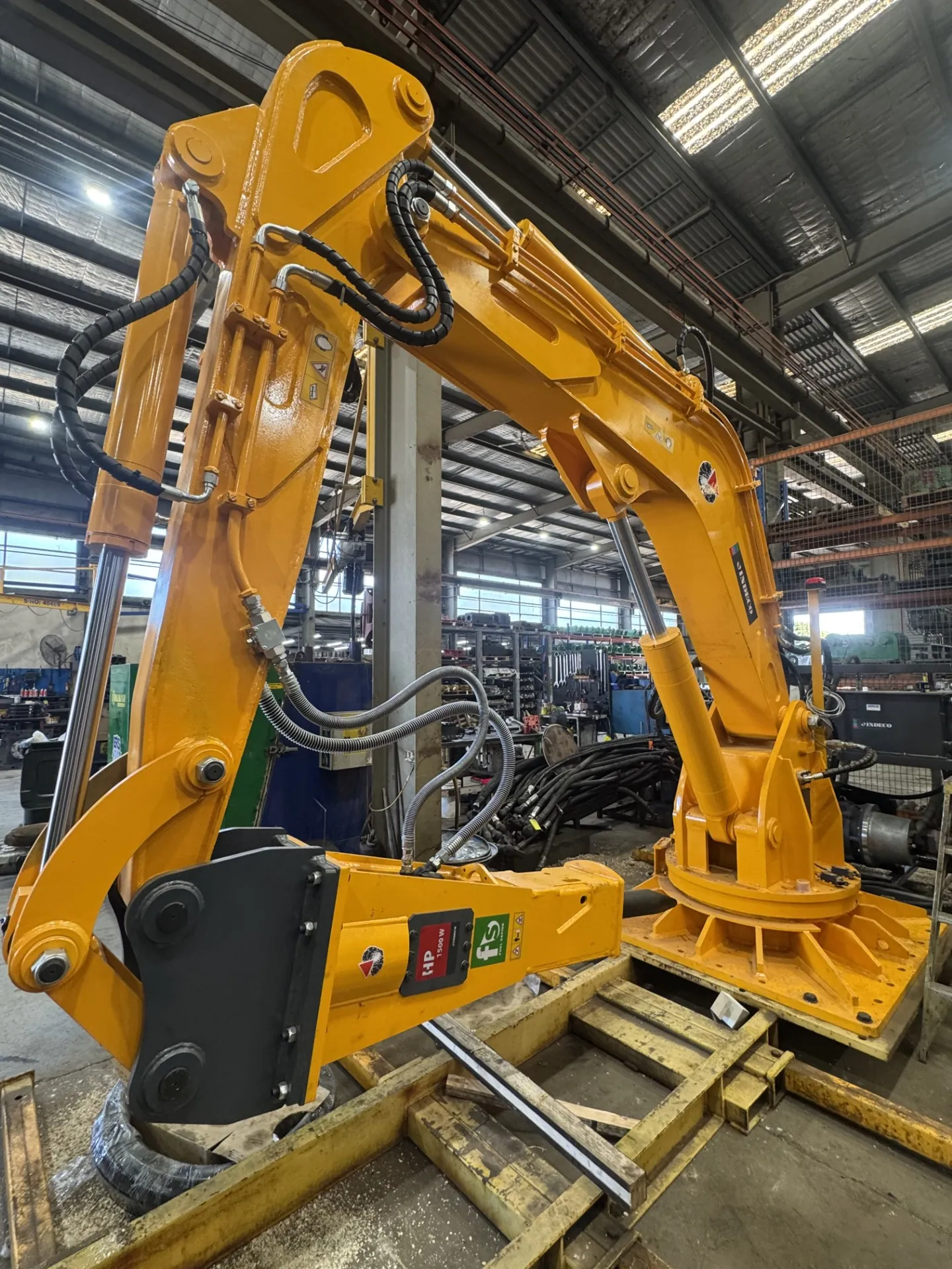 Vehicle loading crane arm stripped down in the JW Hydraulics & Mechanical workshop during a crane repair